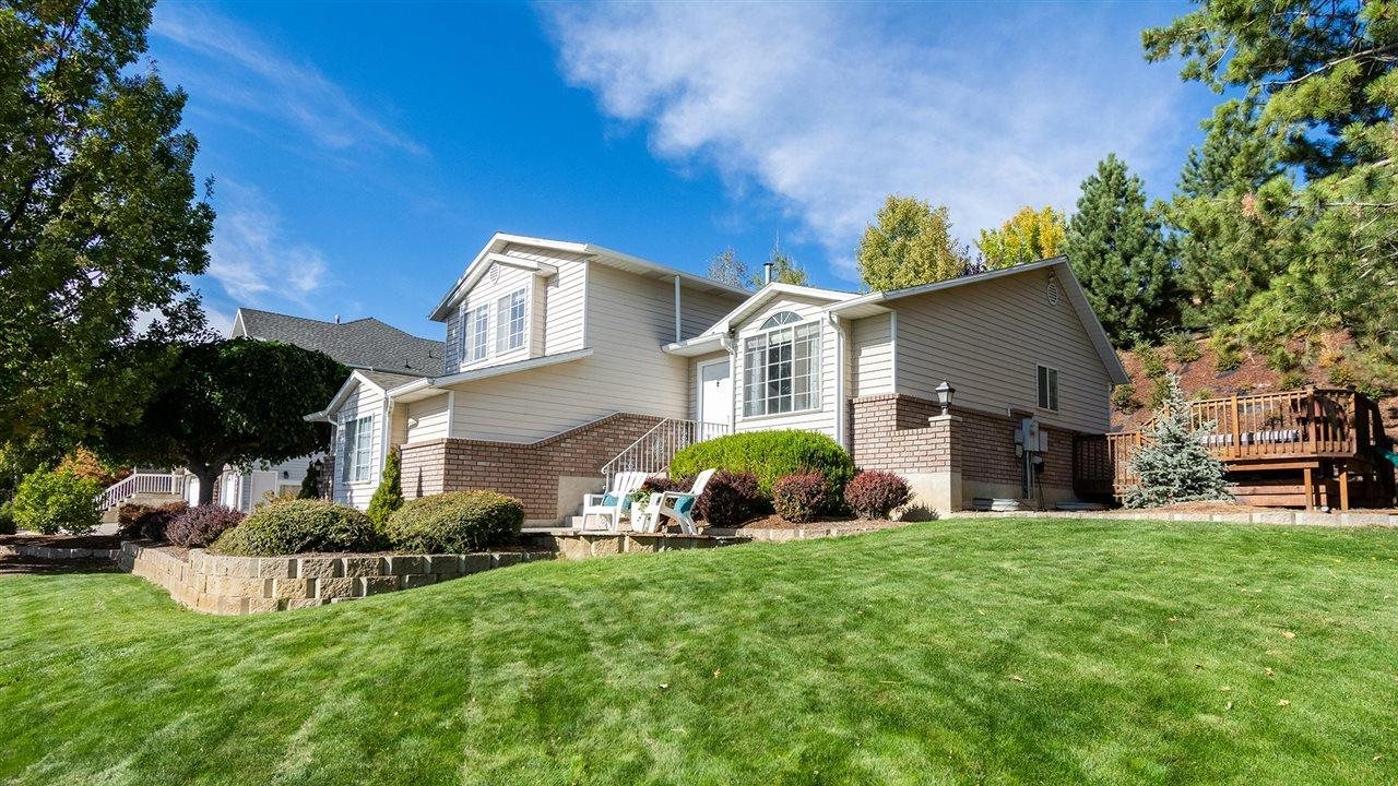 Big, beautiful home with thick green grass. ECHO outdoor power equipment has products to help maintain a beautiful lawn.