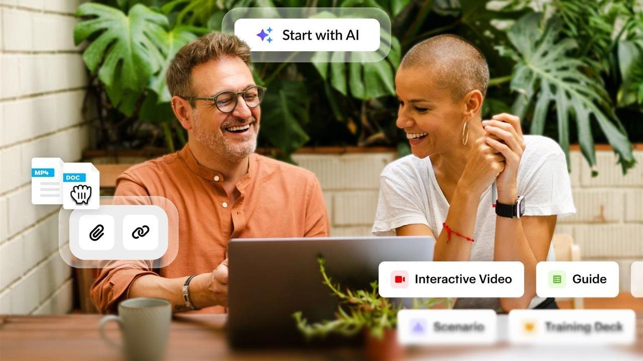 Man and woman working on a laptop computer. Articulate, an AI-powered platform, is built to help customer-facing teams.