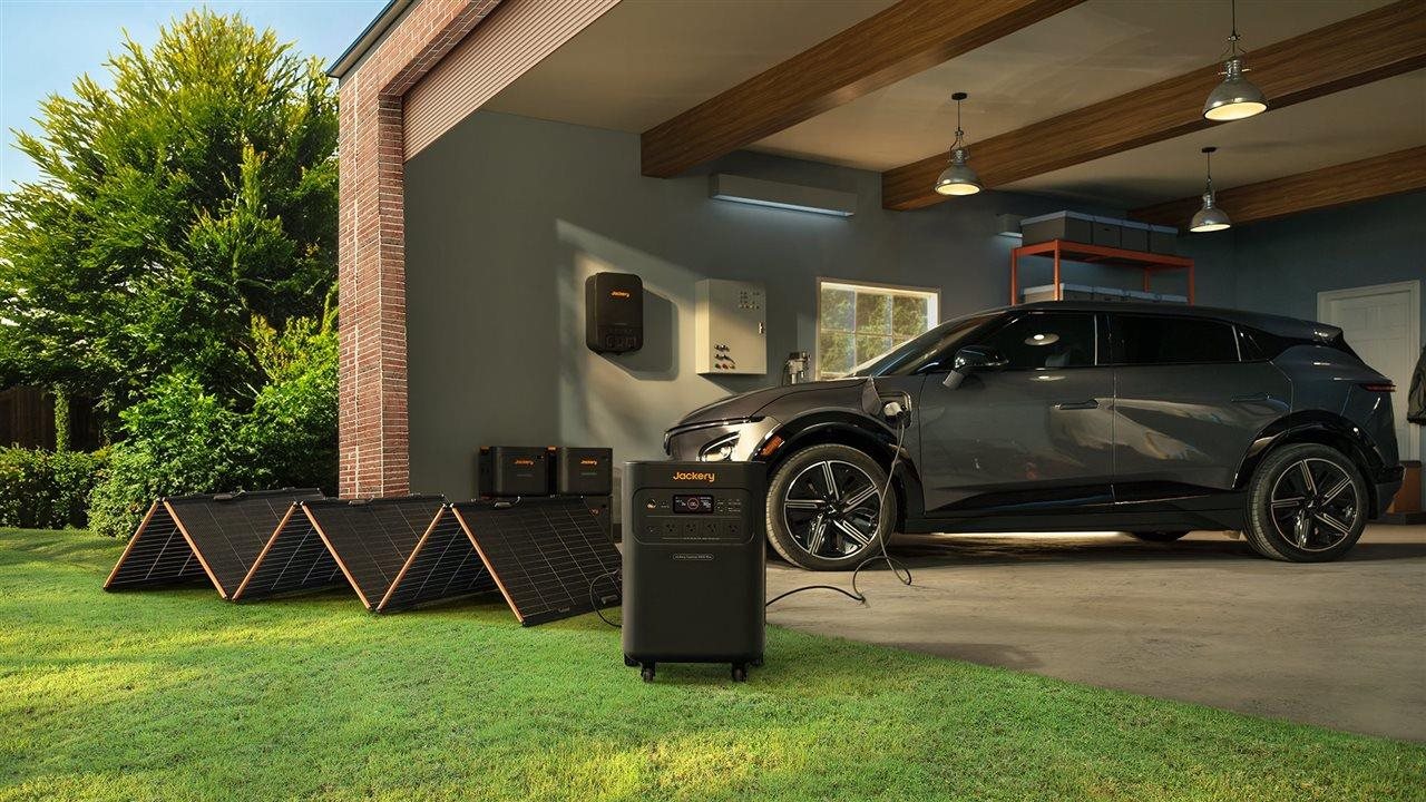 Car in a garage being charged by the Jackery Solar Generator 5000 Plus.
