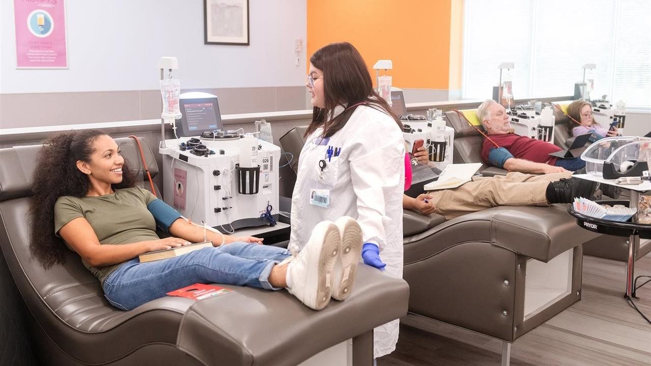 BioLife center staff member with a plasma donor.