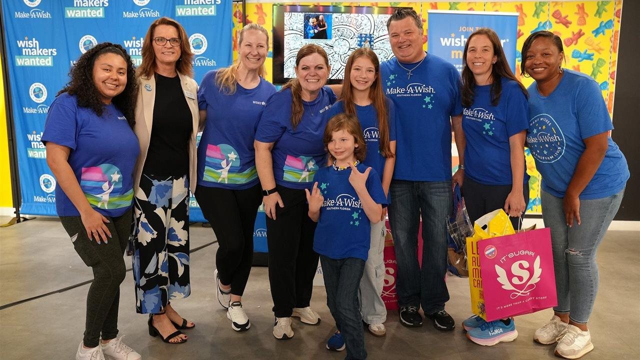 Group of people wearing Make-A-Wish T-shirts. IT'SUGAR is one of the world's largest specialty candy retailers.
