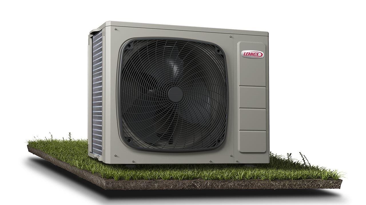 Lennox heat pump on grass.