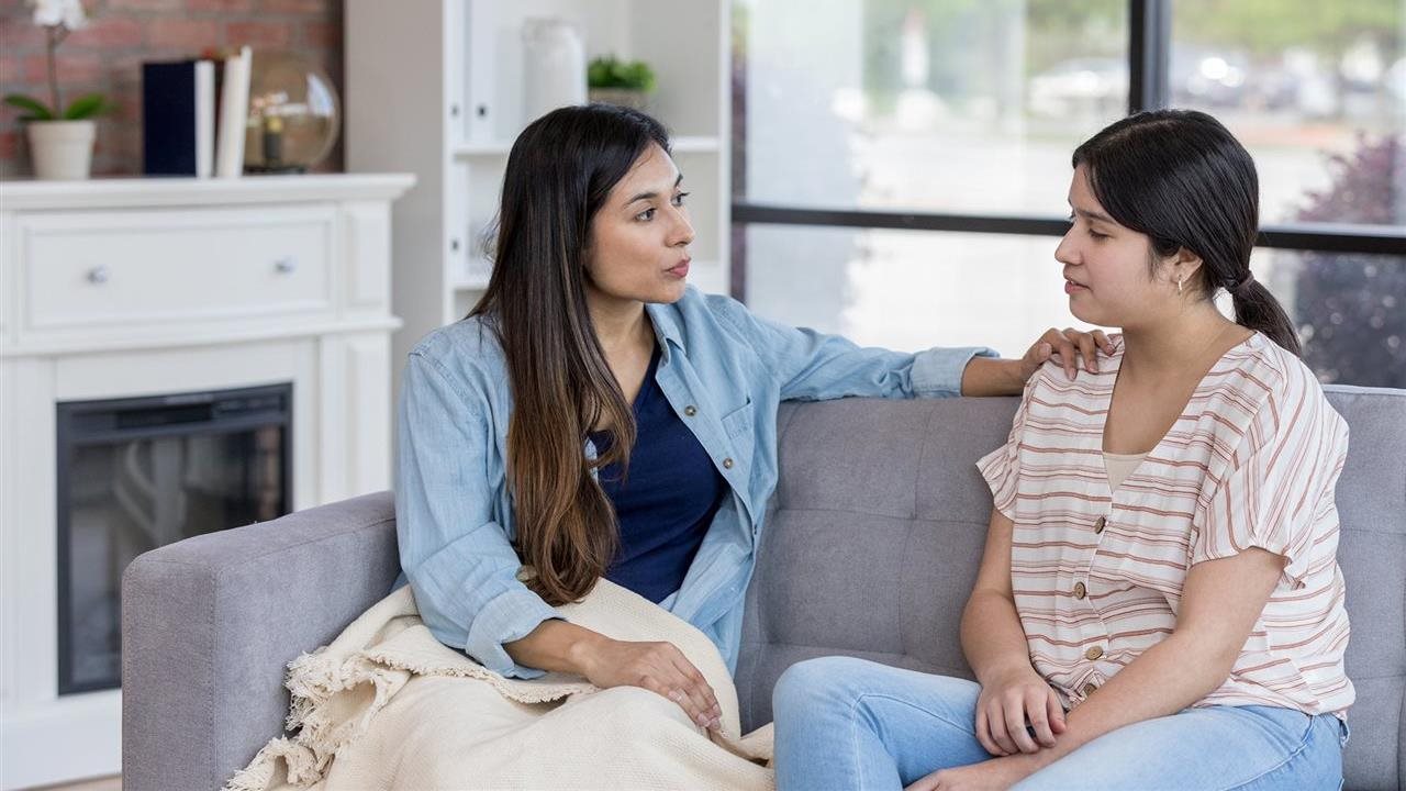 Mother talking with daughter following the CDC's advice to remind teens that the door is always open to continue having a meaningful conversation.