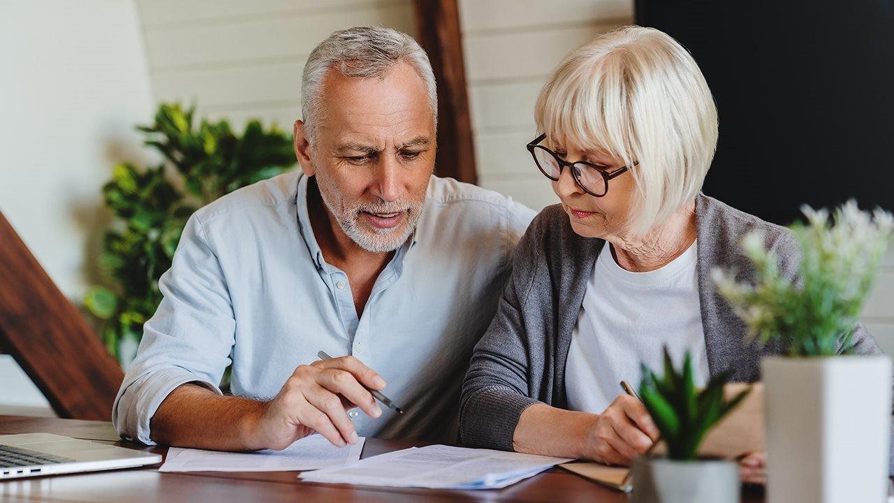 Senior couple reviewing important papers.