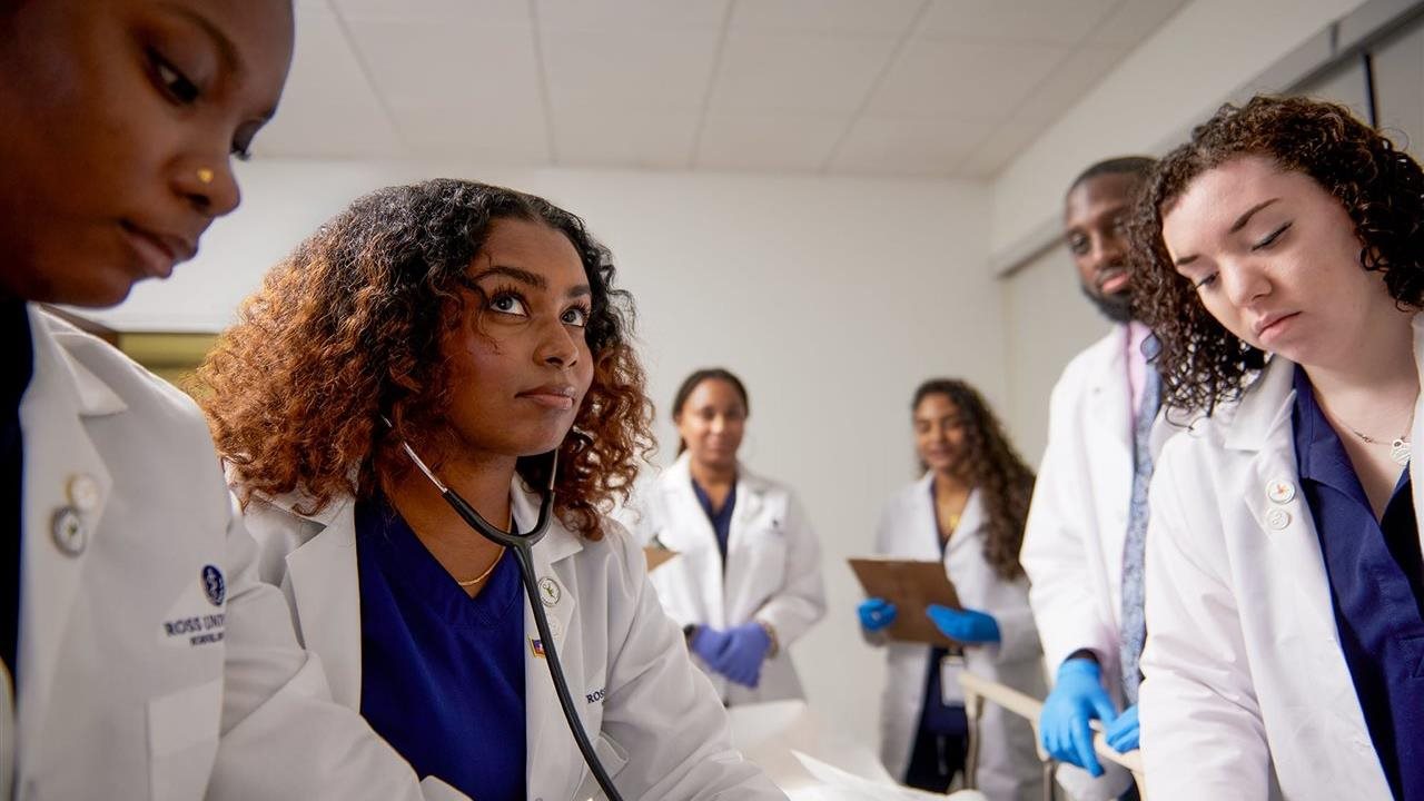 Students at Ross University School of Medicine in a classroom simulation.
