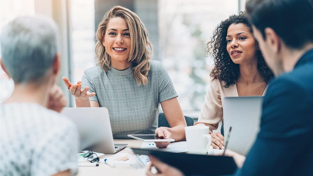 Group of marketing professional discussing a campaign for a client.