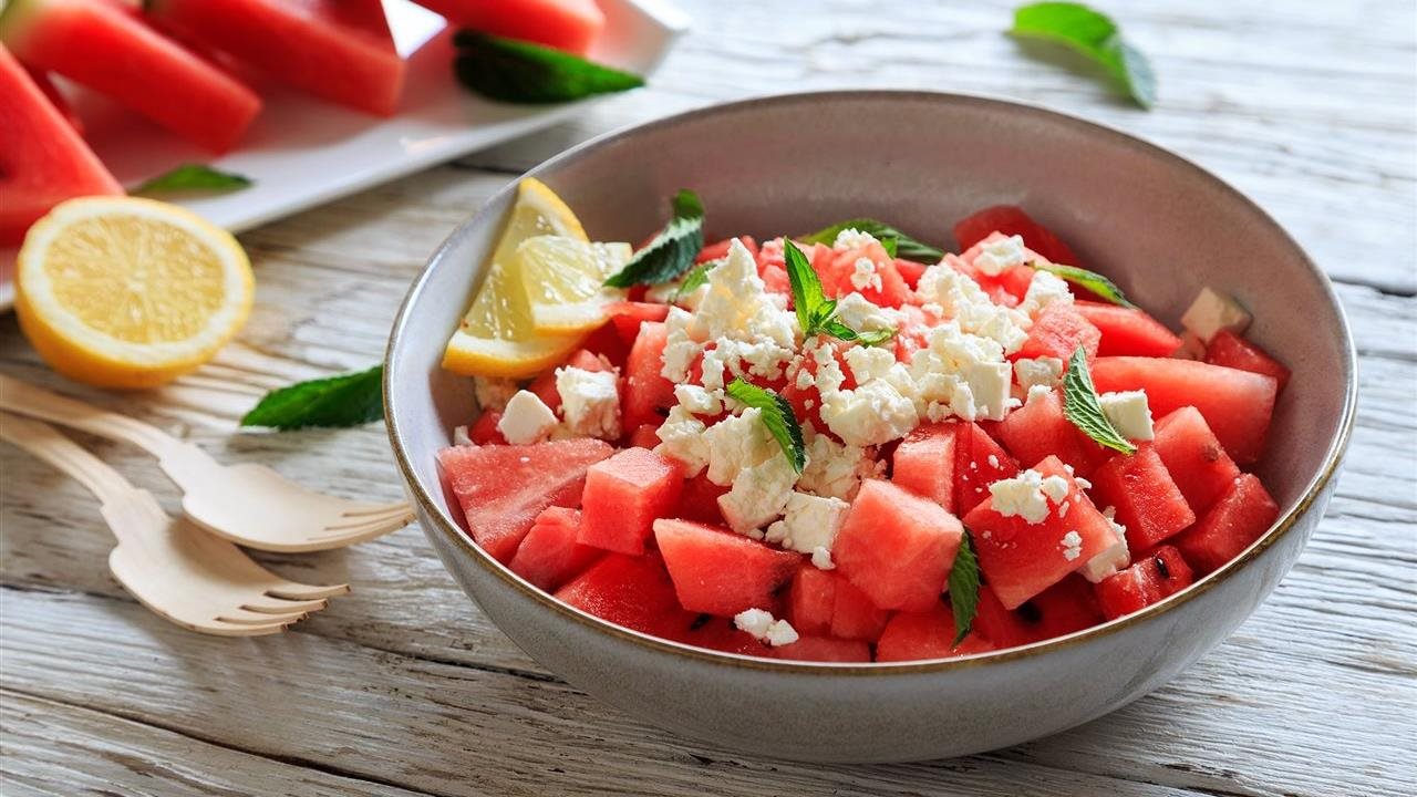 Watermelon feta cheese in bowl on table. Ole Smoky Moonshine blends seamlessly into lemonade.