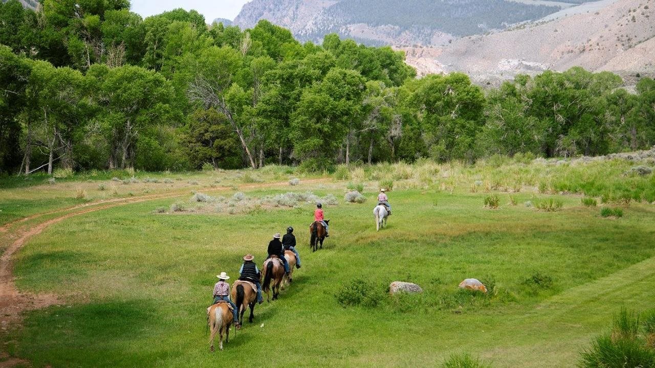 Six horse riders enjoying the trail at CM Ranch.