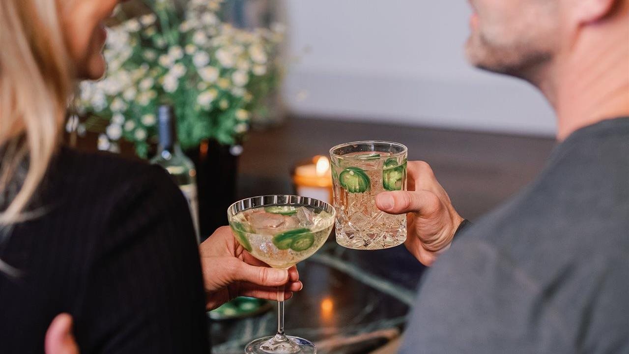 Woman and man enjoying a beverage. Chardonnay from Bonterra Organic Estates, an award-winning winery known for its commitment to organic farming, is deliciously balanced.