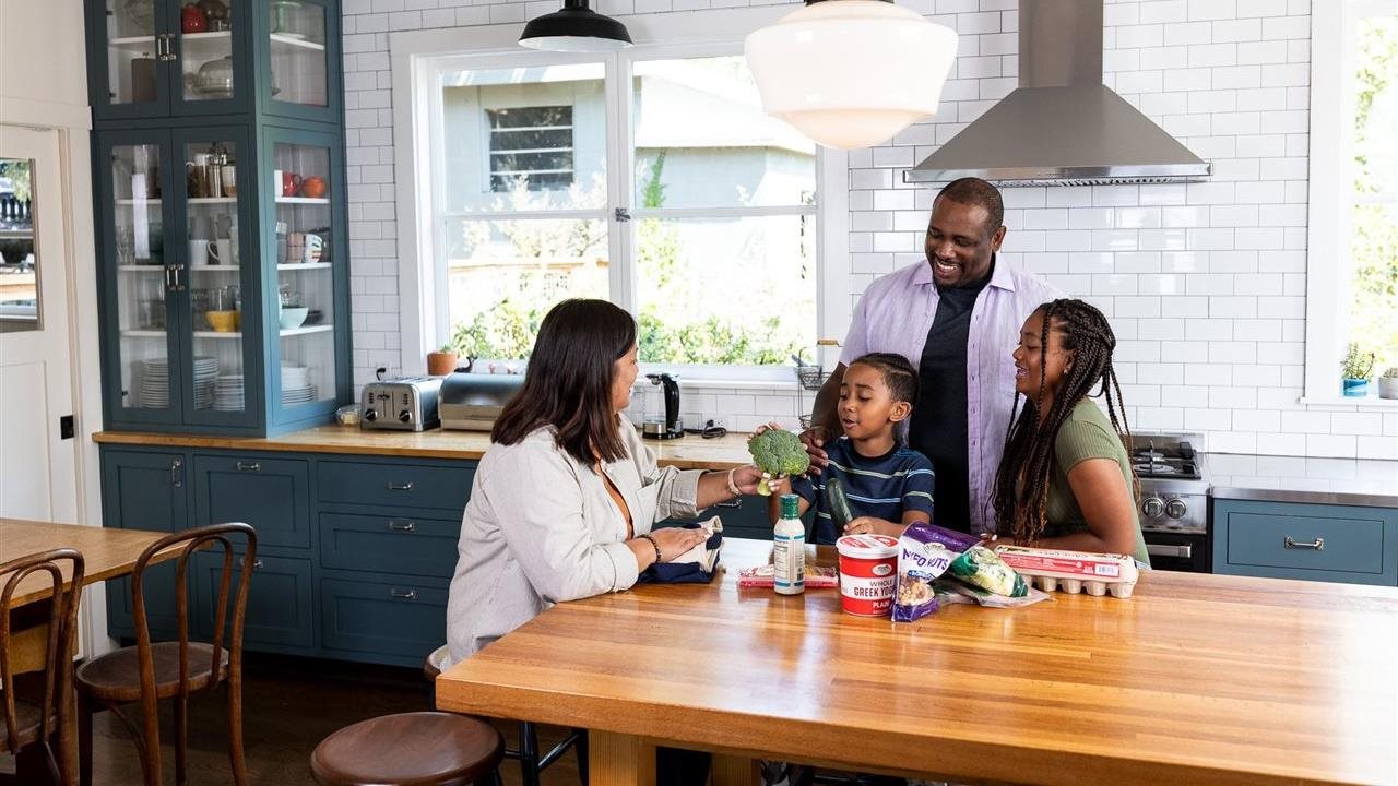Family cooks with health food. Virta Health is a digital health clinic that specializes in metabolic disease reversal.