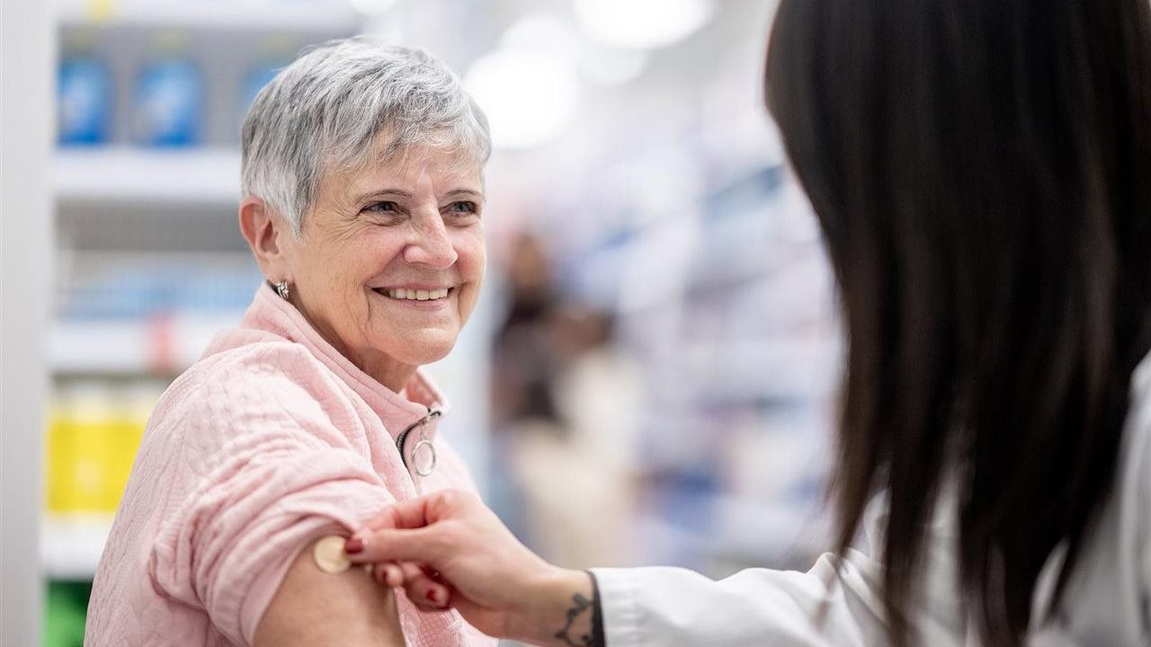 Woman getting a vaccination at a pharmacy. Walgreens encourages seniors to get the shingles vaccination.