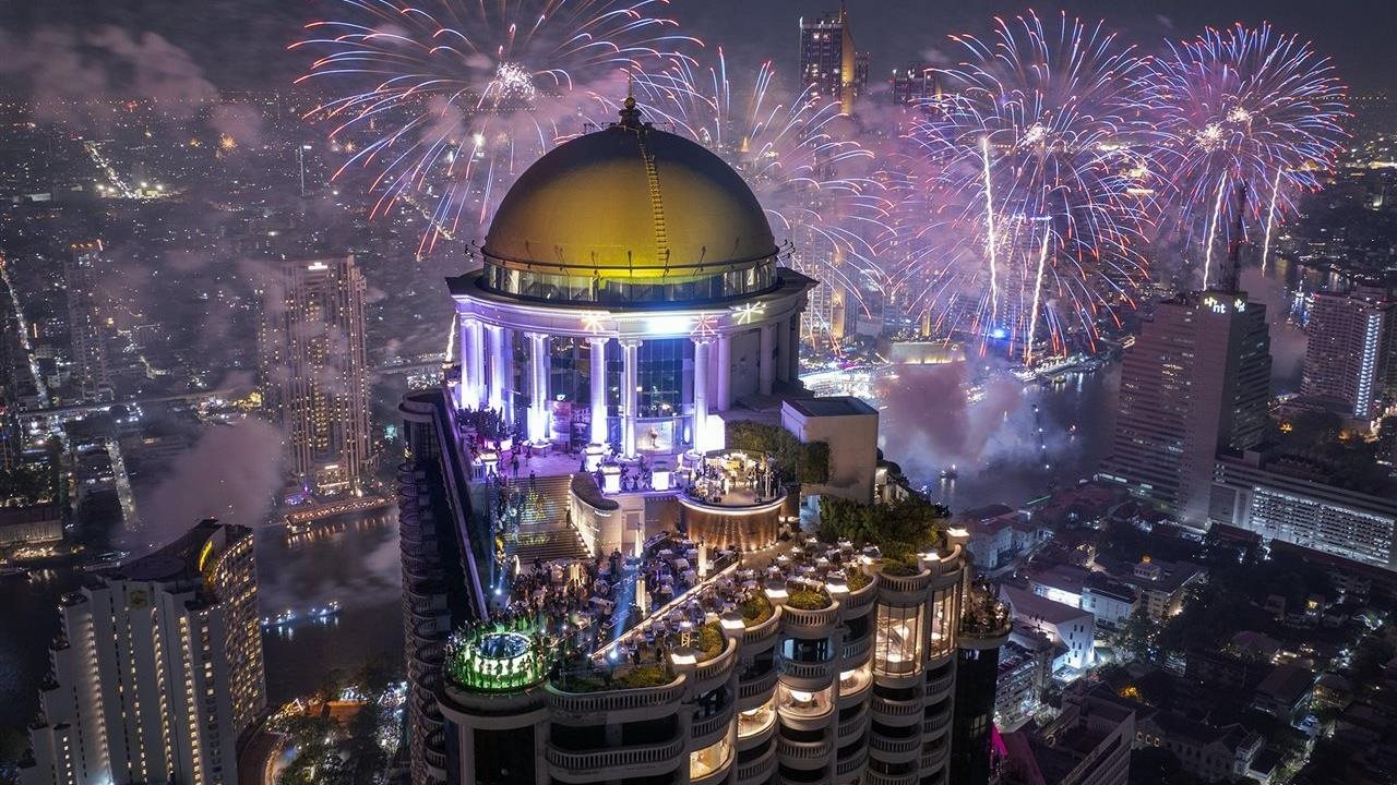 The Tower Club dome in lebua Bangkok surrounded by fireworks on New Year's Eve.
