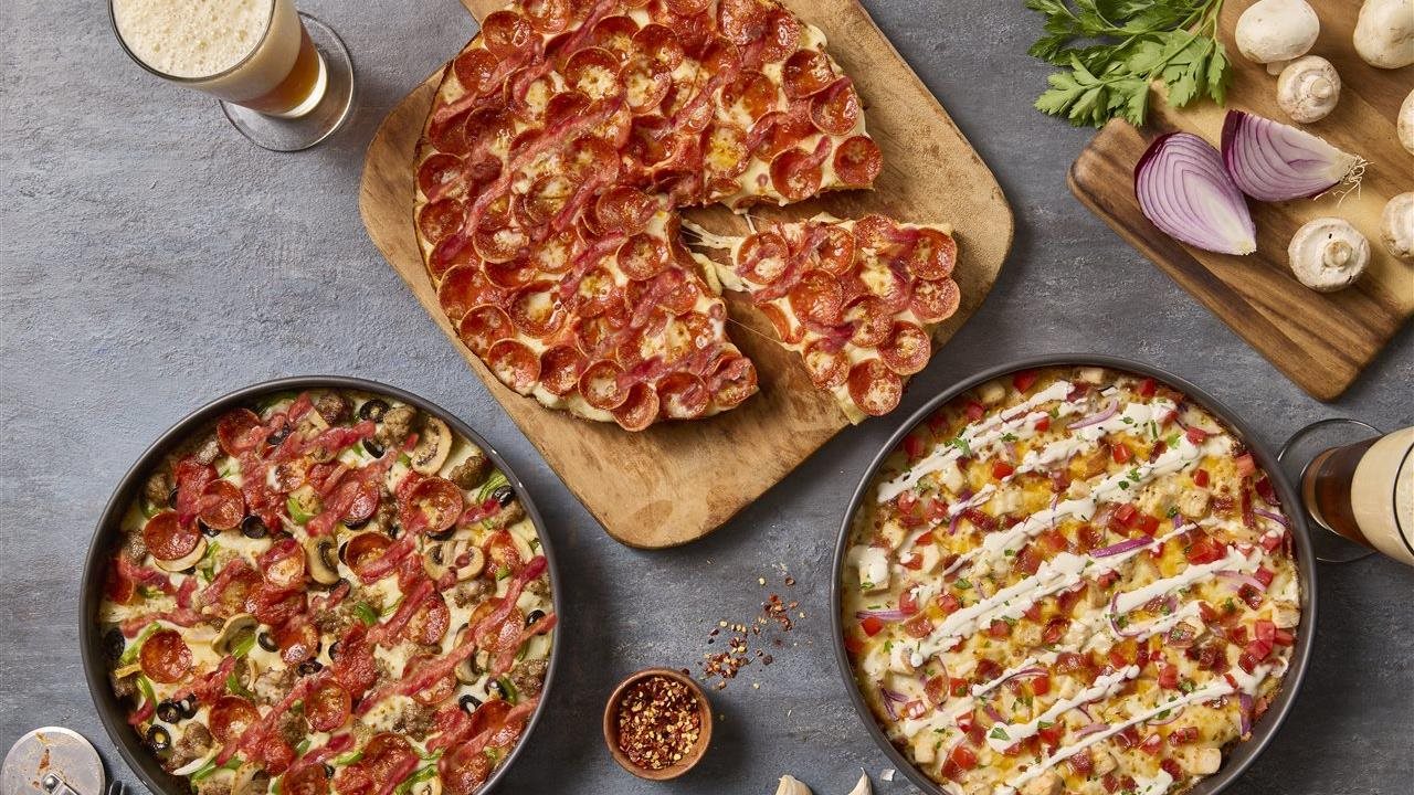 Three pizzas with glasses of beer. Since 1978 BJ’s Restaurant and Brewhouse’s award-winning pizzas have served as a catalyst for bringing friends, family and communities together