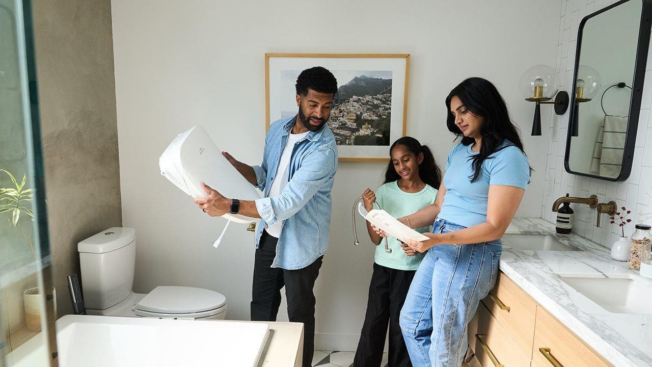 Family installing a bidet in their bathroom