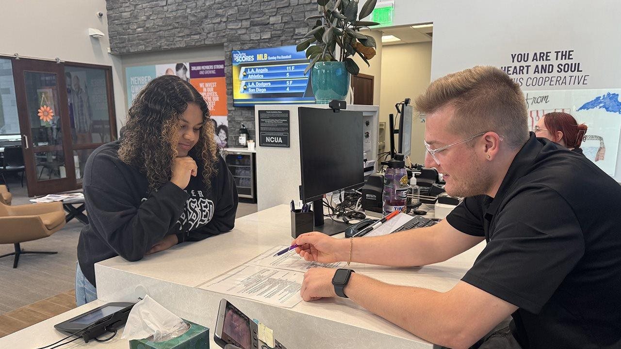 Eli meeting with a representative from Affinity Plus
