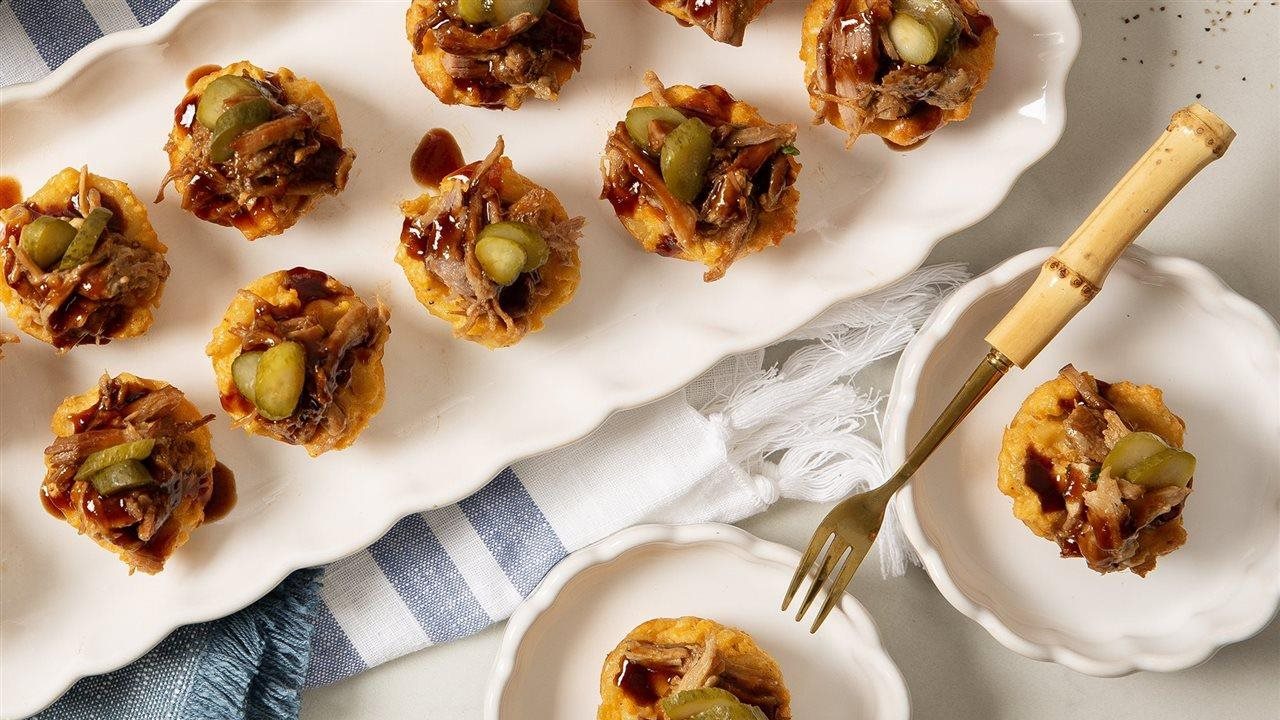 Bob Evans Barbecue Pork Macaroni and Cheese Bites on a serving tray and individual plates.