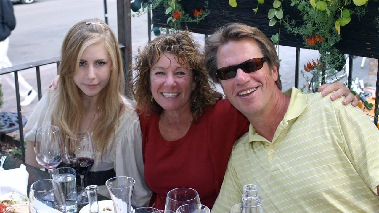Victor Strecher with his daughter Julia Strecher and wife Jeri Rosenberg having dinner. Vic has a podcast called PurposeCast.