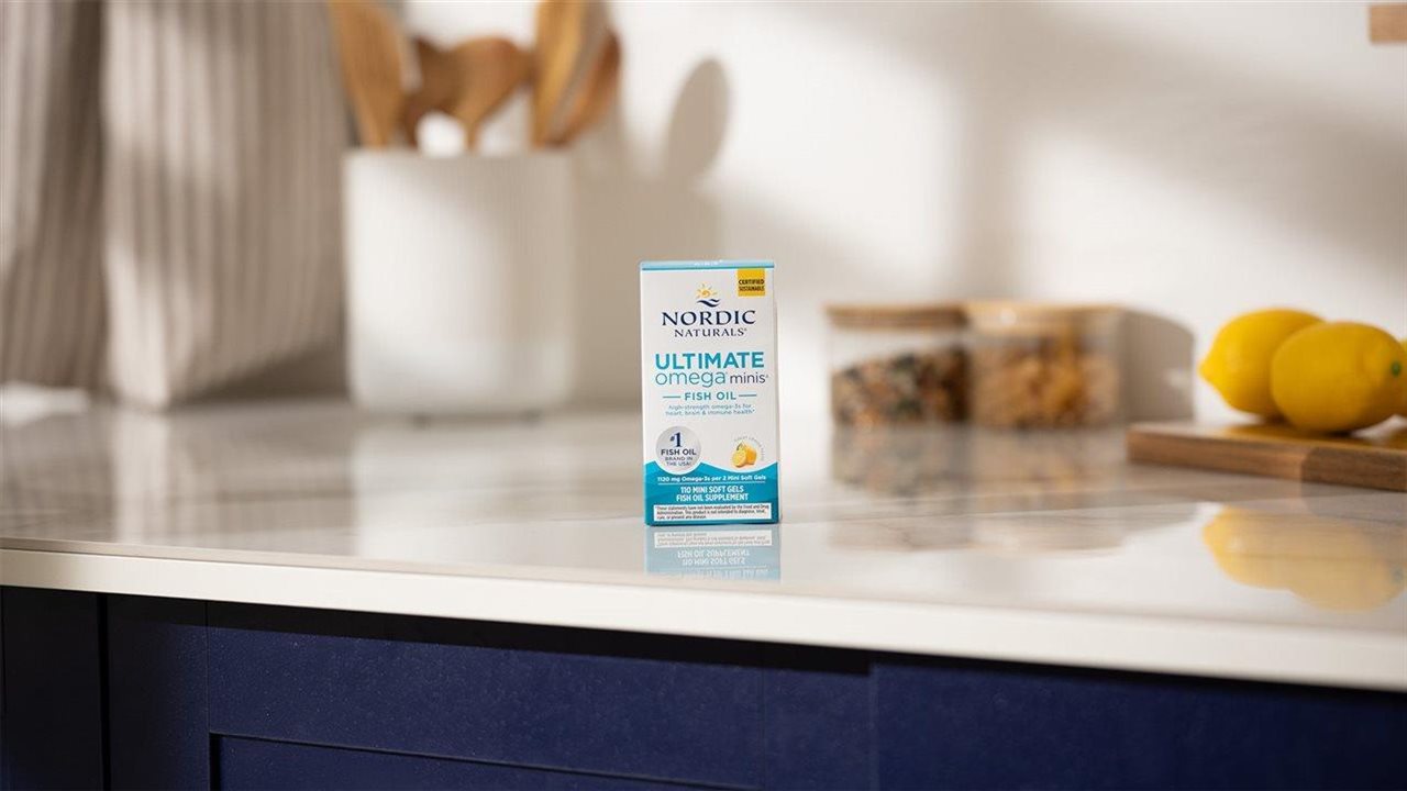 Kitchen counter with a package of Ultimate Omega Minis near a bowl of lemons.