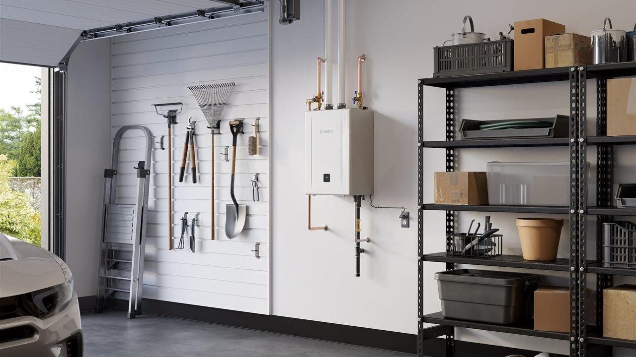 Noritz EZ Series Pro tankless water heater mounted on a wall in the garage.