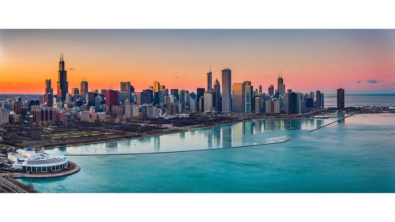 Chicago skyline at sunset. Southwest Rapid Rewards® Credit Cards, from Chase delivers pre-flight seat selection and earlier boarding.