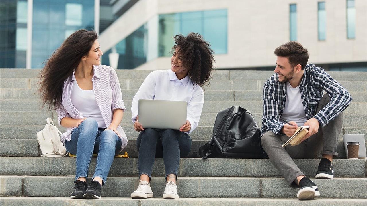 Teen students talking on steps. The National Council for Mental Wellbeing says if teens show signs of mental health challenges, friends may be the first to help.
