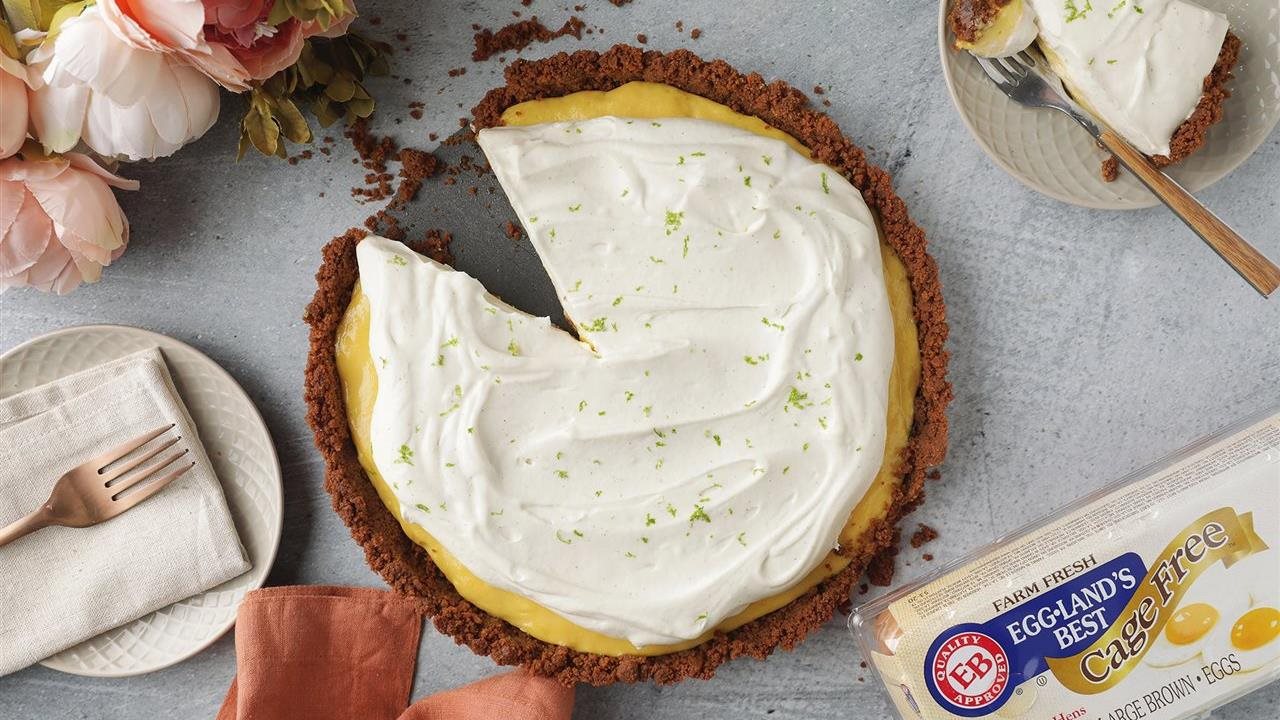 Mango Key lime pie on counter next to carton of Eggland's Best Cage Free brown eggs.