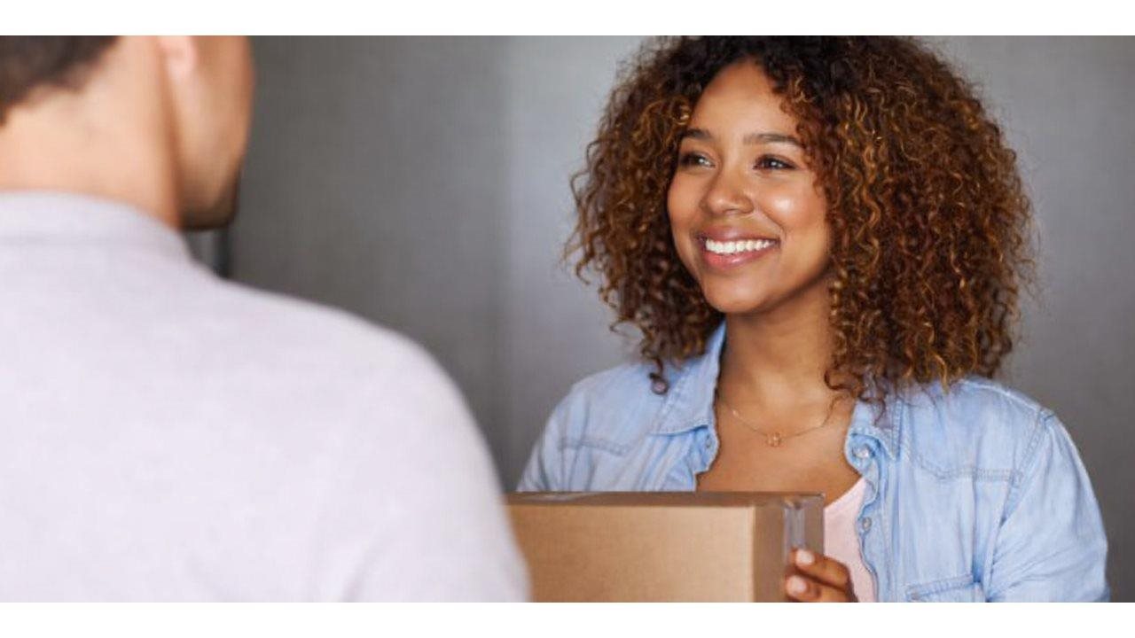 Woman receiving a package delivery.