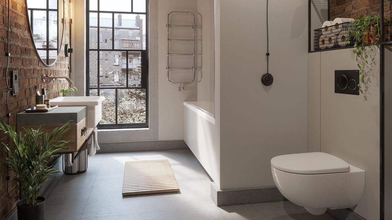 Urban style bathroom with Geberit's in-wall systems which conceal the toilet water tank and sink plumbing behind the wall