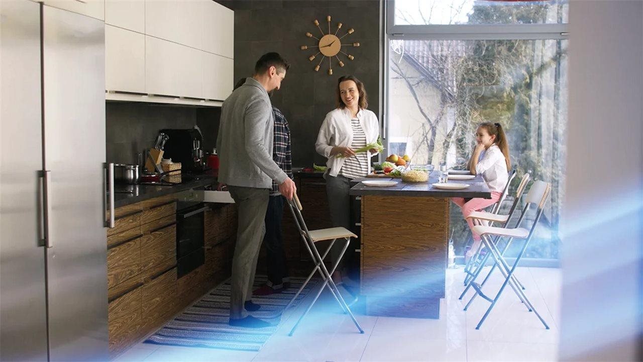 Family in kitchen. The Panasonic OASYS™ automatically changes indoor air quality, temperature and humidity.
