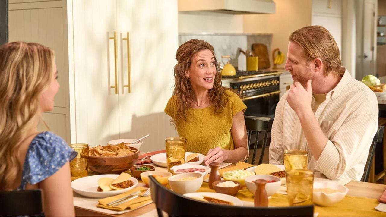 Family having dinner together in the kitchen.