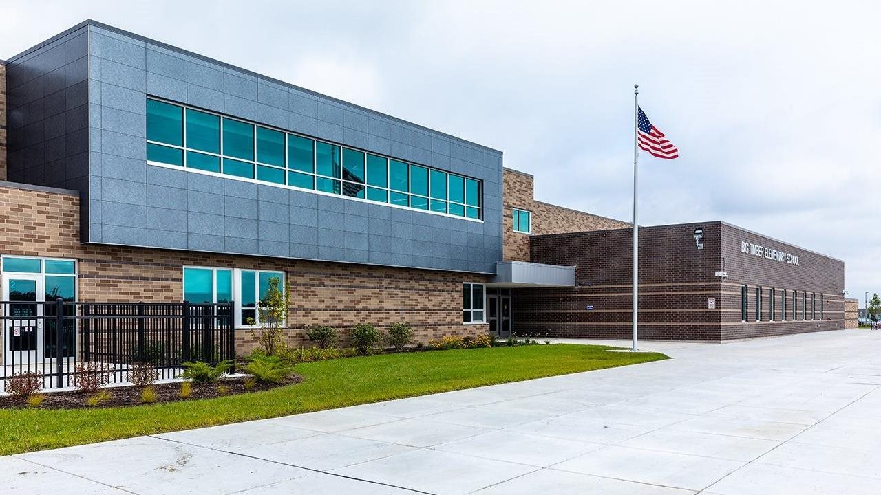 The exterior of a school built from concrete.